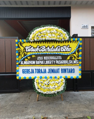 Papan Bunga Duka di Alasa Talumuzoi